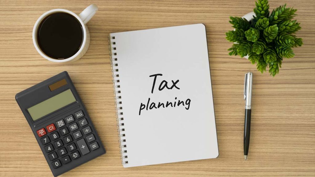notebook with ways to save income taxes on your investments