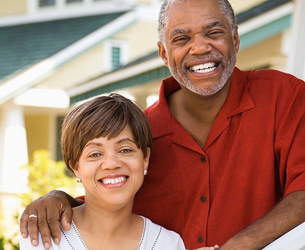 smiling couple in need of retirement planning services