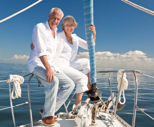 Older couple smiling on a private boat